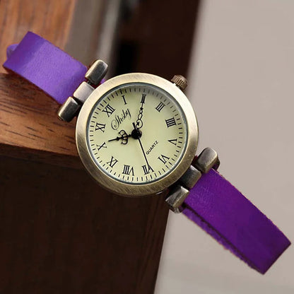 Retro women's watch, classic round face, comfortable leather strap for everyday elegance.