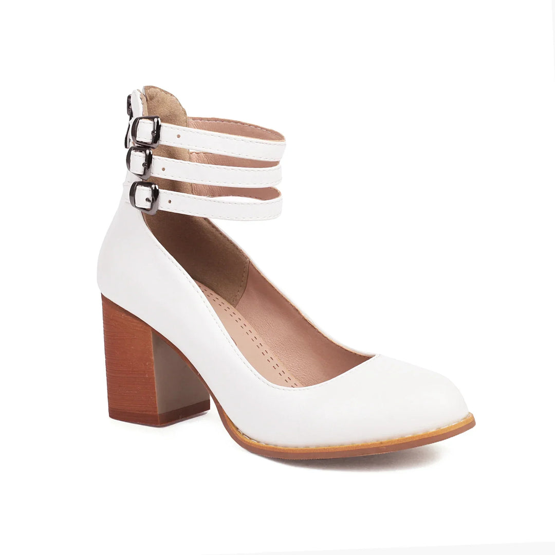 Side profile of women's elegant block heels with intricate strappy details.