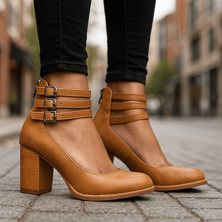 Stylish women's black block heels with delicate ankle strap for versatile fashion.