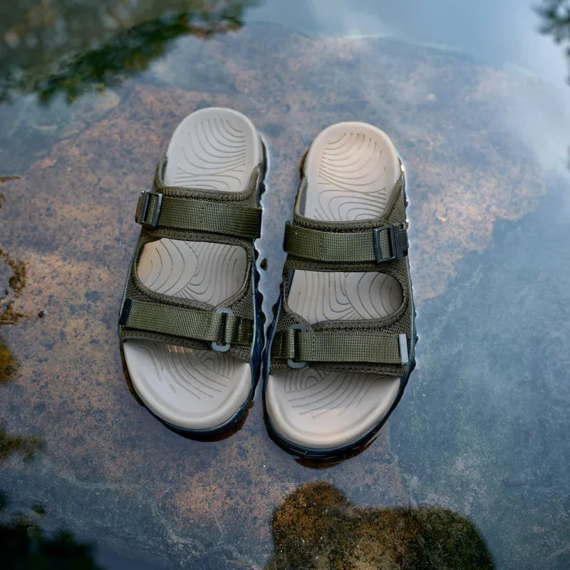 Pair of TerraGlide men's hiking sandals with rugged sole, ready for outdoor trails.