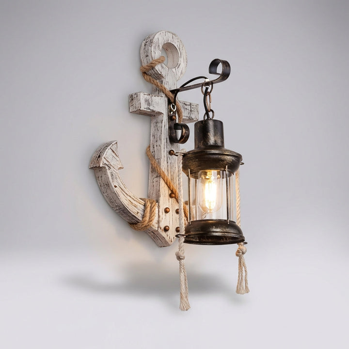 Decorative nautical anchor wall sconce. Perfect coastal lighting for a rustic maritime home ambiance.