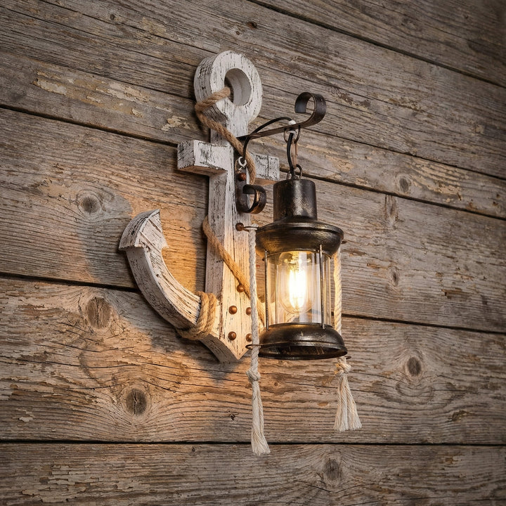 Coastal anchor wall sconce LED light. Decorative nautical wall lighting for rustic maritime home ambiance.
