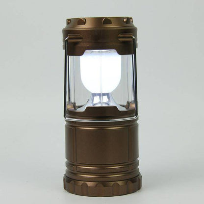 Rechargeable LED flashlight and lantern combo, in use outdoors, versatile survival equipment.