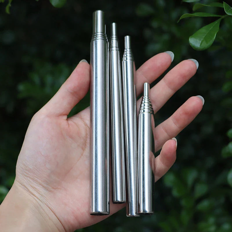 Stainless steel fire bellow blowpipe in collapsed state, showing portability for outdoor gear