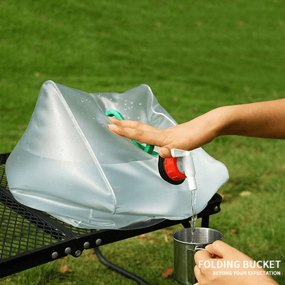 Flexible silicone water bottle, gray, expanded, ready for camping; lightweight, portable hydration solution