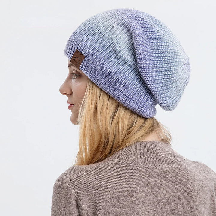Cozy, soft stretch-fit rainbow knit beanie hat for stylish winter fashion.