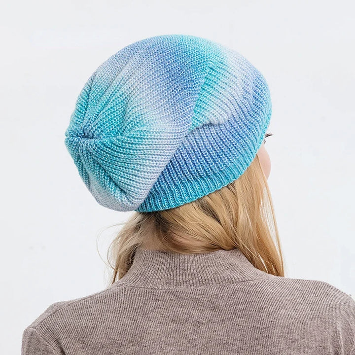 Fashionable unisex rainbow beanie, a vibrant winter accessory for any outfit.