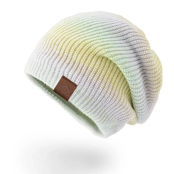 Eye-catching colorful rainbow knit beanie with a comfortable stretch fit for all.