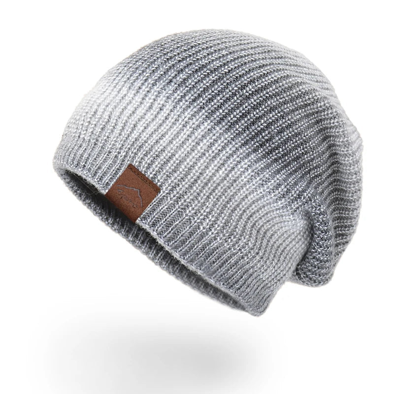 Vibrant rainbow knit beanie hat, ideal for adding a pop of color to winter fashion.