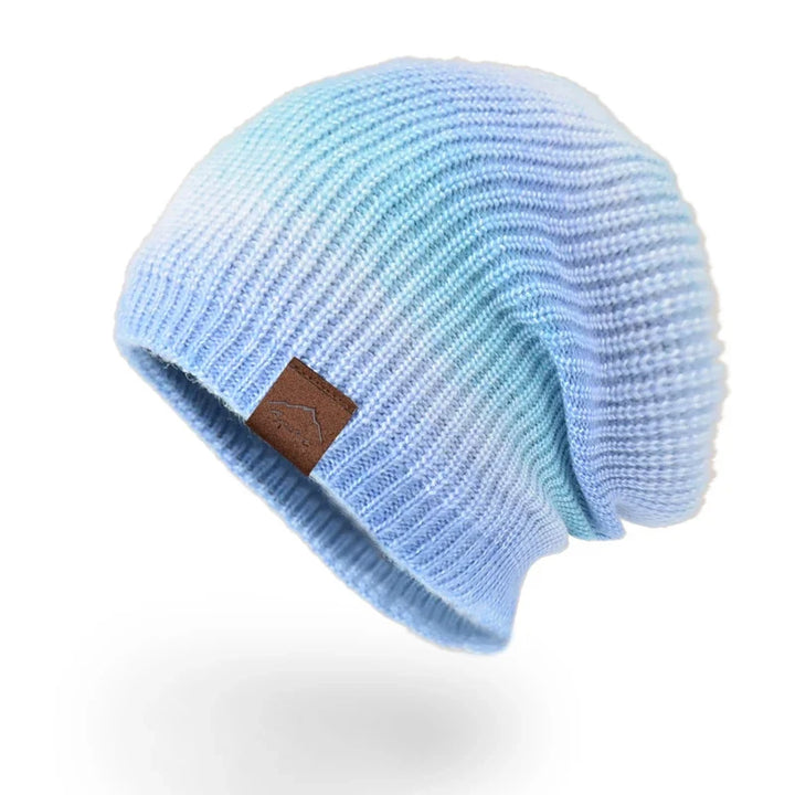Stylish rainbow striped knit beanie, a must-have colorful winter accessory.