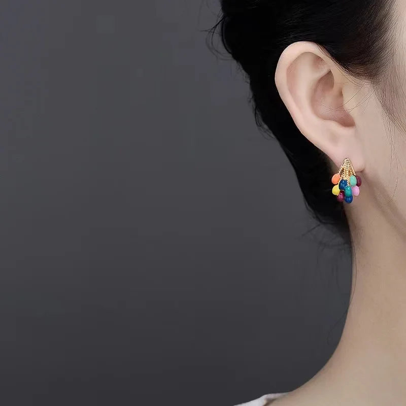 Vibrant women's balloon cluster stud earrings. Colorful enamel design with a shiny gold-tone finish. Playful jewelry.