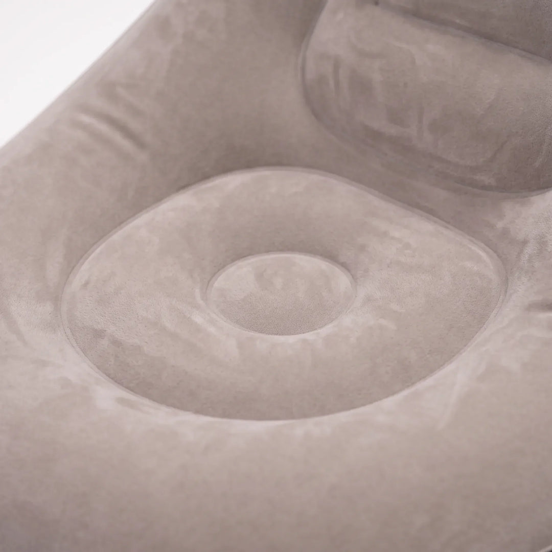 Versatile inflatable air chair & footrest, great for living room comfort or indoor seating.