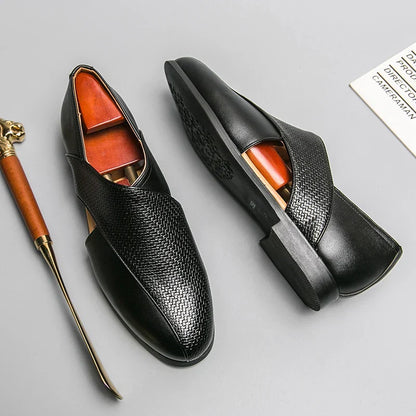 Sleek men's slip-on loafers, showcasing a minimalist design for sophisticated wear.