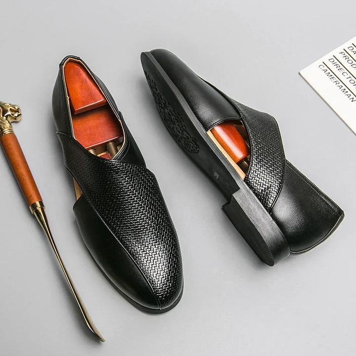 Sleek men's slip-on loafers, showcasing a minimalist design for sophisticated wear.