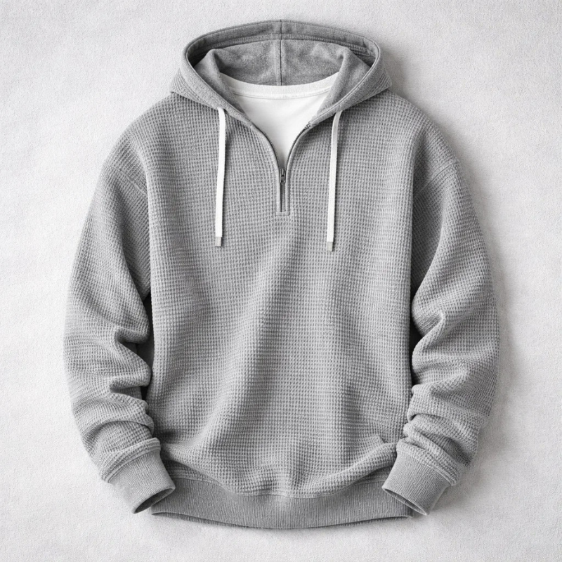 Close-up of the rich texture on this men's cozy waffle knit hoodie, highlighting quality.