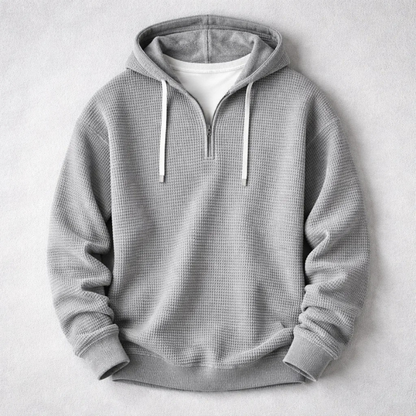 Close-up of the rich texture on this men's cozy waffle knit hoodie, highlighting quality.