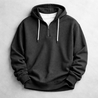 Man wearing a comfortable men's waffle hoodie, perfect for a relaxed casual weekend.