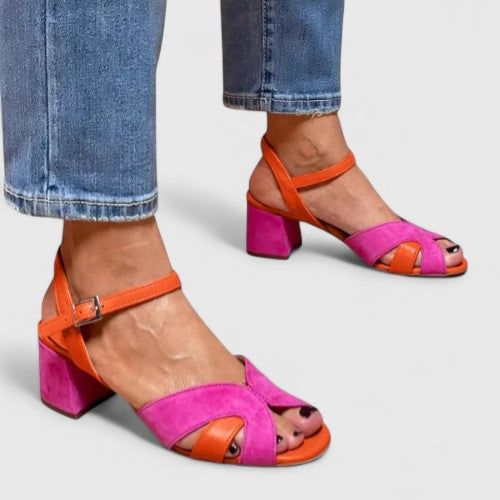 Women's comfortable pink wedge sandals with strappy design, ideal summer casual footwear.