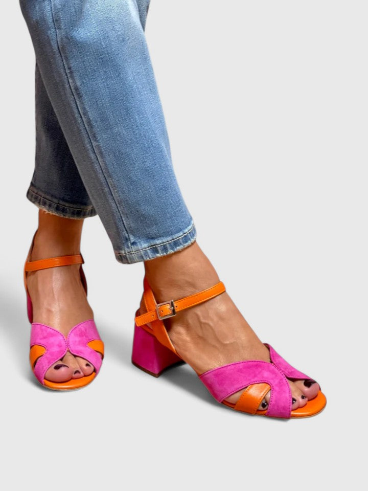 Stylish pink strappy wedge sandals for women, great for comfortable summer casual outings.