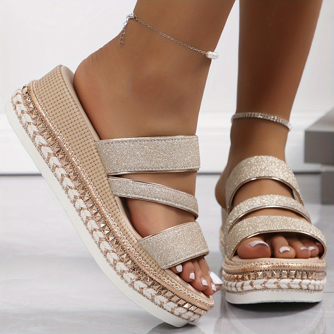 Durable flat beige sandals for women with comfortable sole, great for casual slip-on everyday wear.