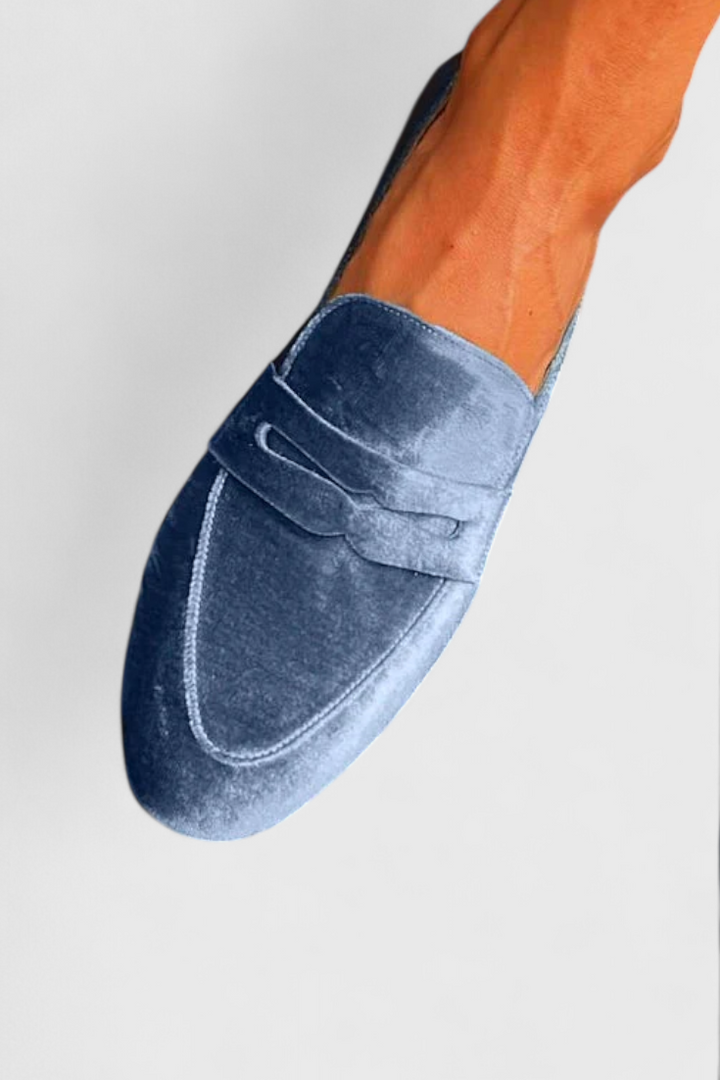 Stylish women's blue slip-on flat loafers for everyday comfort. Perfect versatile spring and summer fashion shoes.