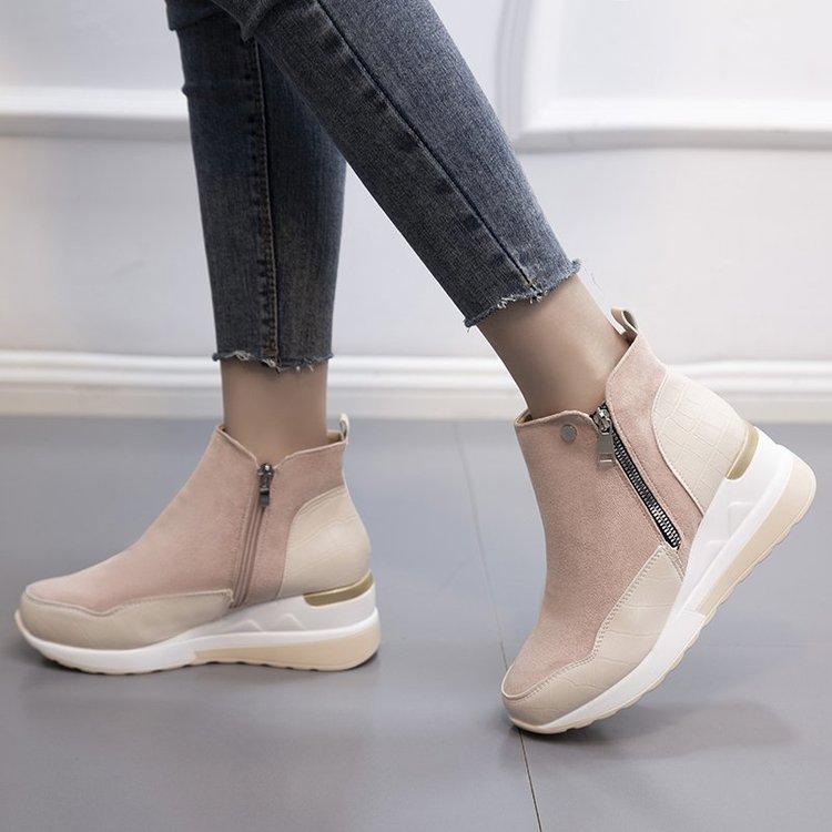 Modern women's mid-top sneakers with arch support, offering casual style and comfort for daily wear.