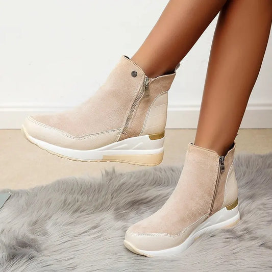Comfortable women's wedge ankle boots with side zipper, cushioned for everyday wear.