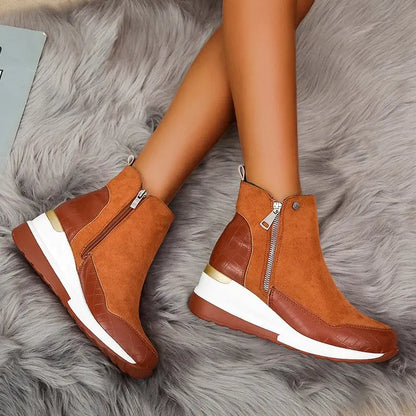 Modern women's comfortable wedge ankle boots, easy slip-on with a side zipper for style.