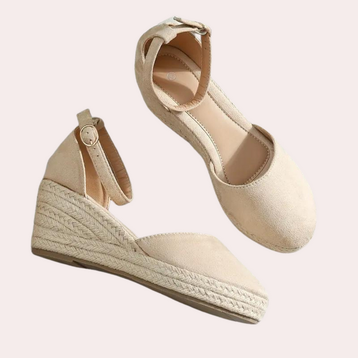 Elegant Alina women's wedge sandals featuring a secure adjustable buckle strap for a perfect fit.