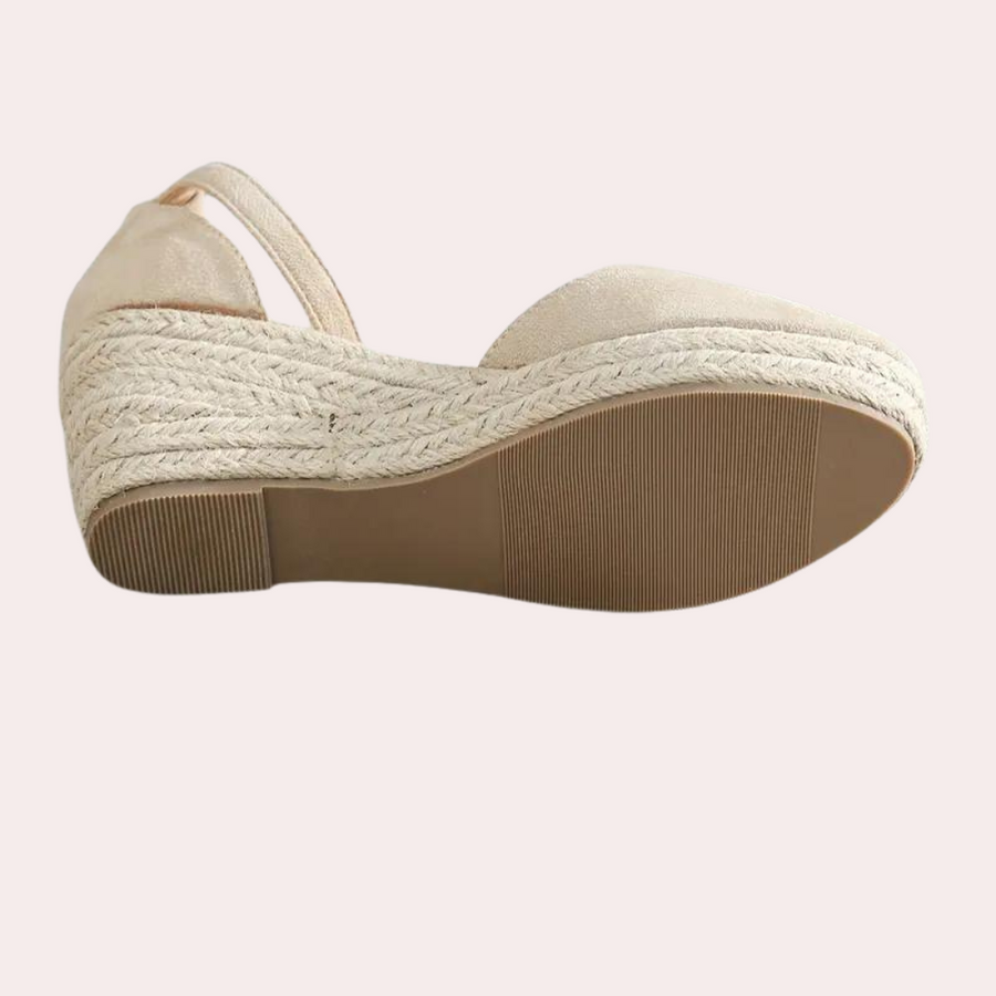 Ladies' comfortable wedge sandals with adjustable strap, ideal for office or summer casual fashion.