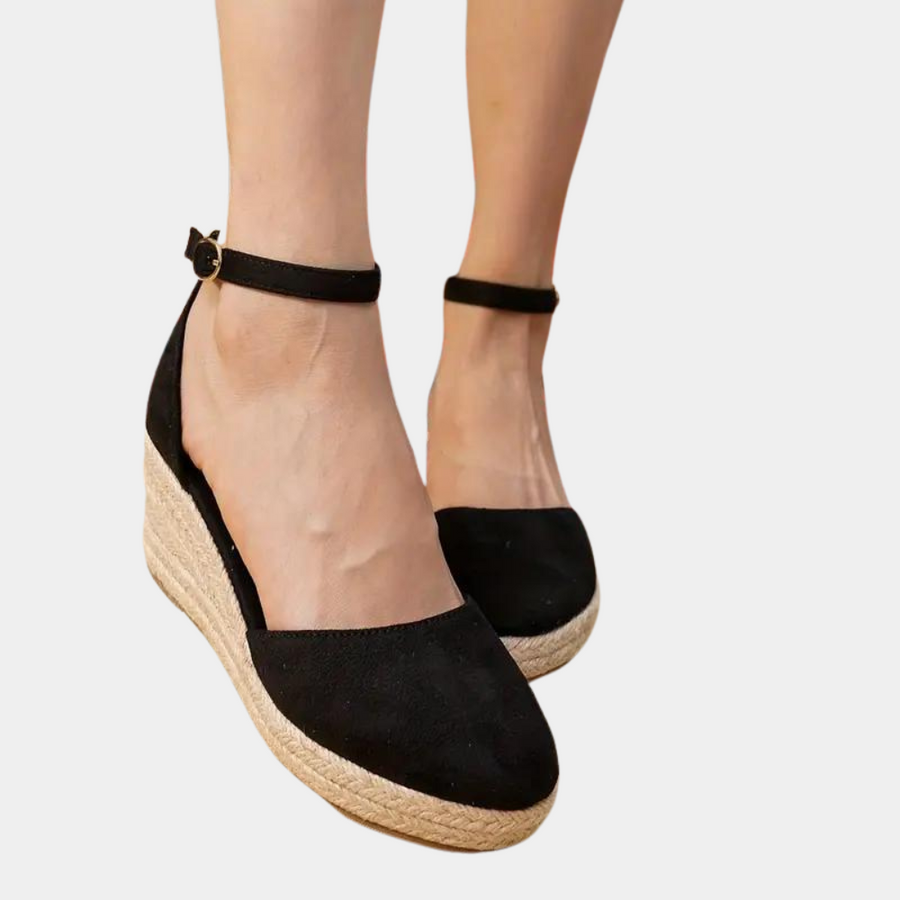Stylish women's wedge sandals with a practical adjustable strap & comfortable sole for all-day wear.
