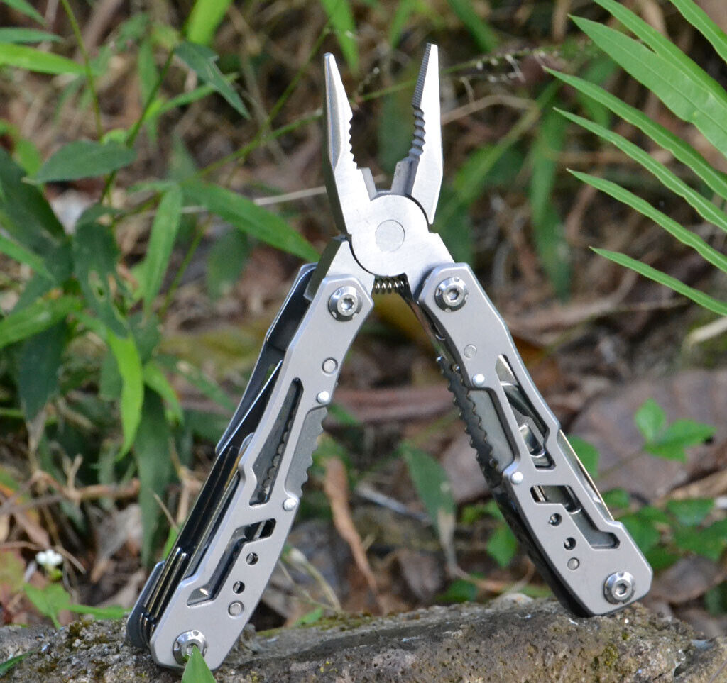 Stainless steel multitool against a natural outdoor background, rugged and ready