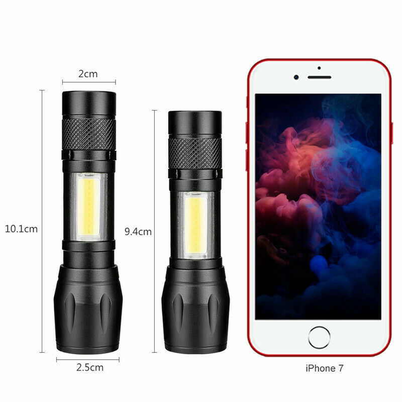 Tactical flashlight, 900lm USB rechargeable, next to camping equipment