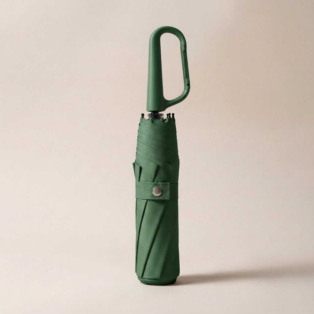 Clip-on foldable umbrella, closed and ready for travel, highlighting its small size and easy carry.