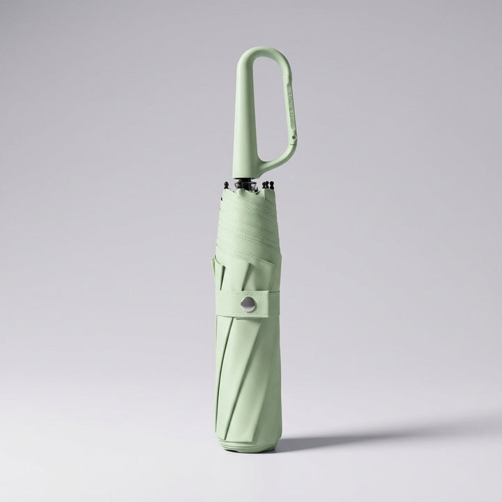 Unisex compact clip-on umbrella, offering waterproof protection and UV resistance for all weather.