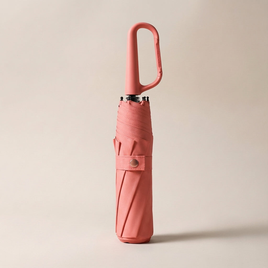 Waterproof UV protection umbrella, compact and foldable, shown with its practical clip-on feature.