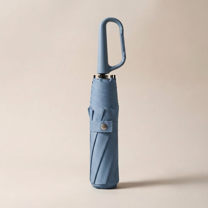 All-weather durable umbrella, designed as a compact, foldable, and clip-on solution for commuters.