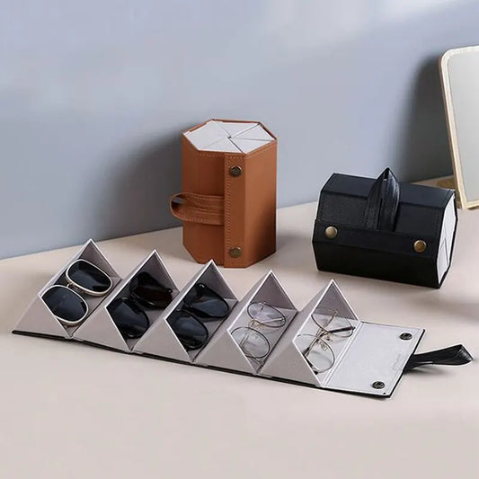 Compact black leather multi-slot roll-up glasses case, perfect for organizing and protecting eyewear during travel.