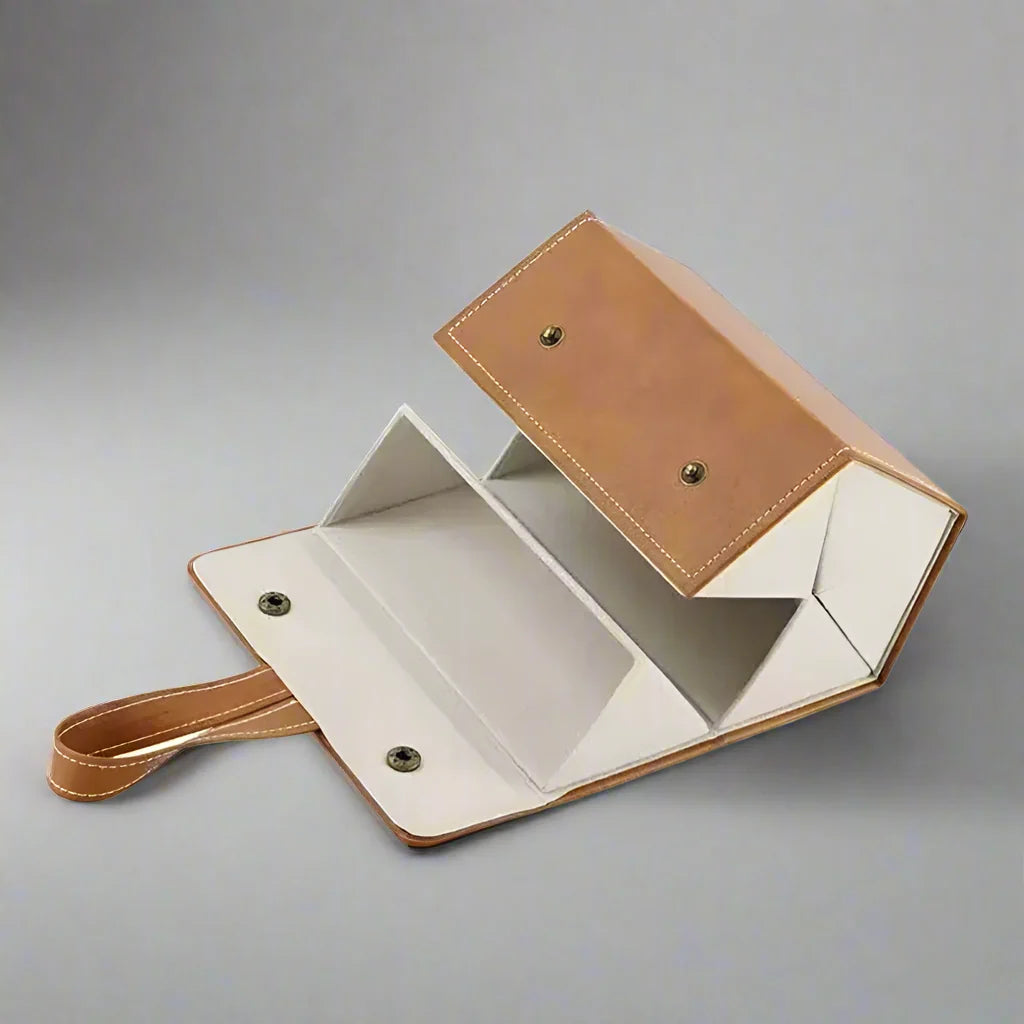 Multi-slot brown leather glasses organizer, a stylish and secure way to store several pairs of eyewear.