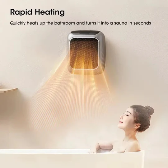 Small wall-mounted electric space heater with digital display, offering quick ceramic heat for personal comfort.