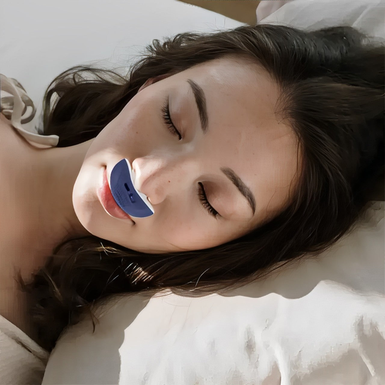 Close-up of a micro CPAP device, featuring nasal dilators for improved breathing & anti-snoring aid.