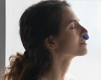 Portable anti-snoring sleep device providing quiet sleep apnea relief. Innovative breathing aid for users.