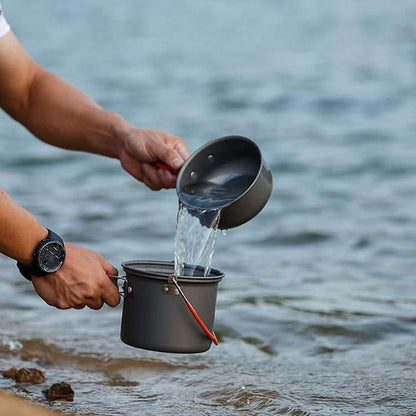 Compact camping cooking system, includes pot, pan, and lid, perfect for outdoor adventures
