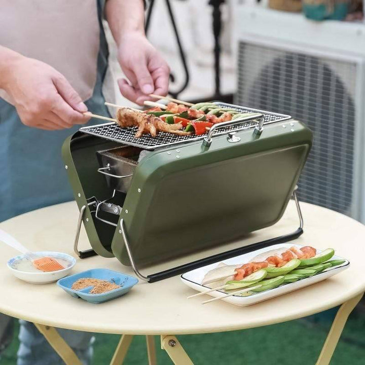 Lightweight charcoal grill for outdoor cooking, great for small spaces and travel.