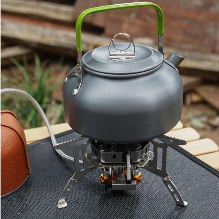 Small portable gas stove featuring a sturdy grate for camp kitchen cooking, ideal for hiking adventures.