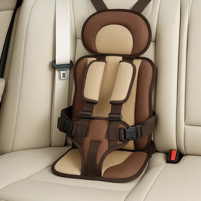 Toddler portable booster seat, grey fabric, compact for travel, ensuring safety & comfort for kids.