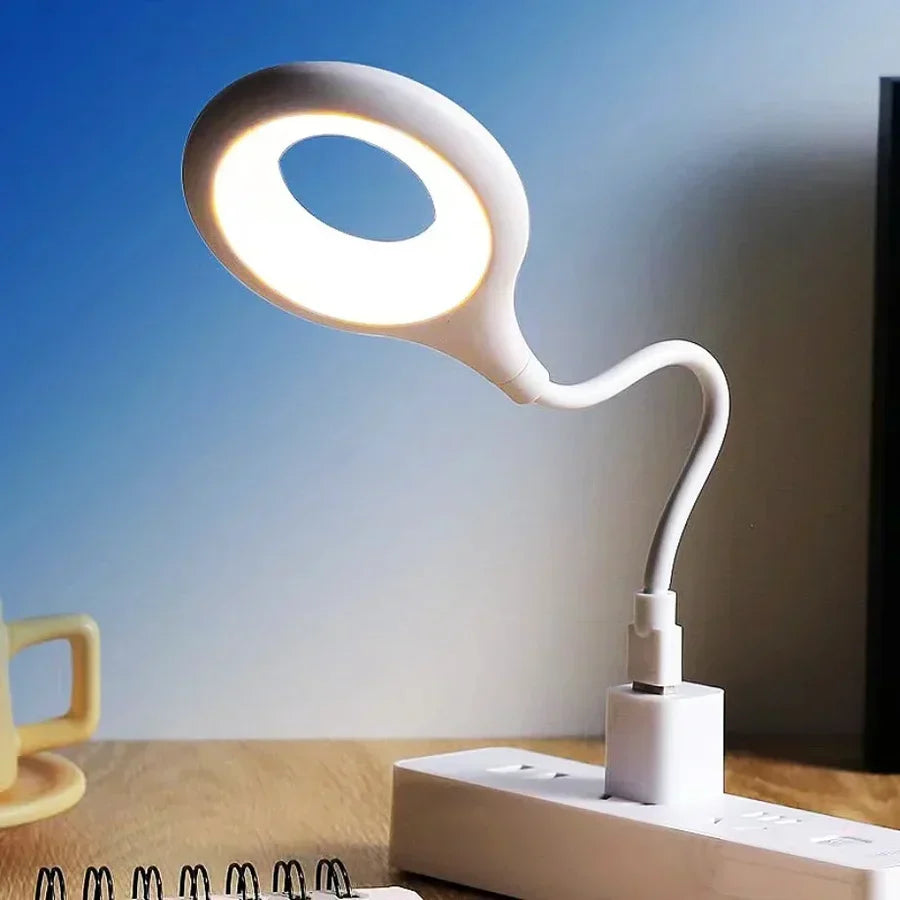 Compact rechargeable LED night light, SoftGlow for gentle bedroom or nursery lighting, USB charging.