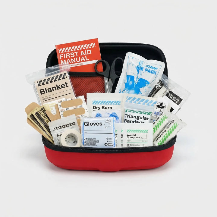 Red and black compact waterproof first aid kit, perfect for travel, camping, hiking, and emergency preparedness.