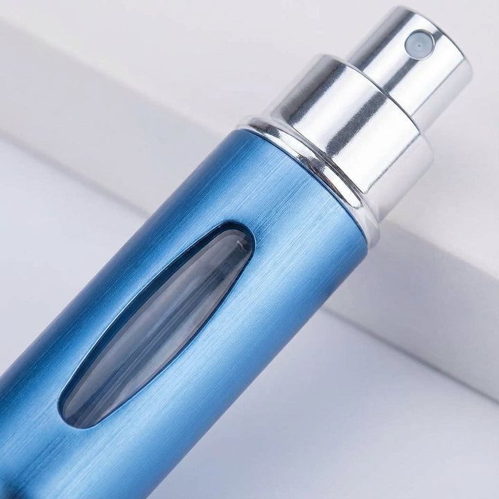 Mini portable perfume atomizer, perfect for travel. Discreet pocket-sized fragrance spray accessory.
