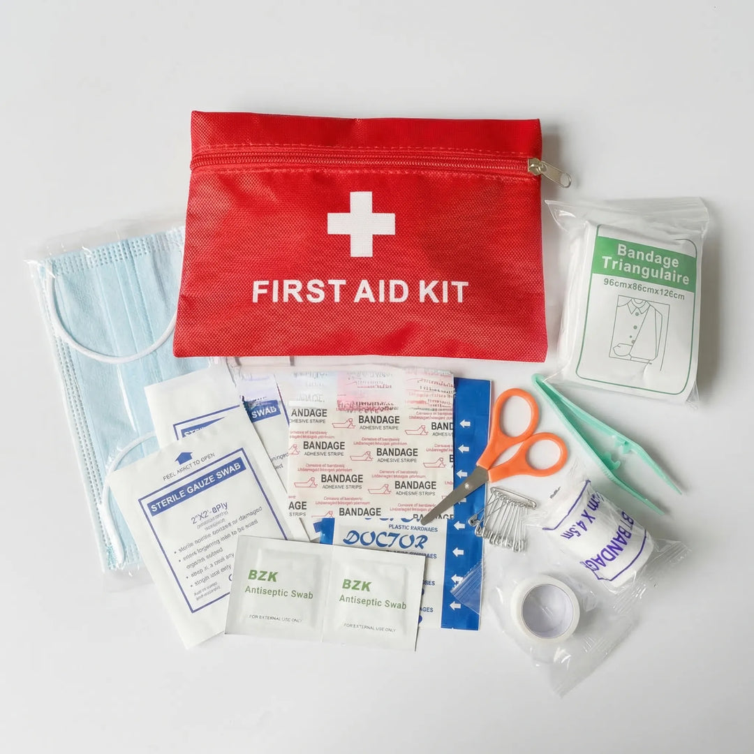 Portable tactical first aid kit with essential medical supplies for emergency preparedness in outdoor activities & travel.